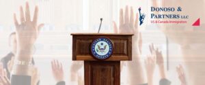 podium and raised hands