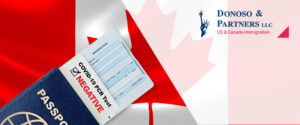 Canadian flag and passport with Covid-19 negative