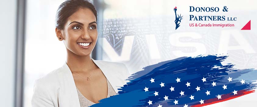Woman smiling with a partial US flag