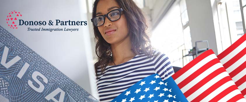 US Flag, Visa and woman with glasses smiling