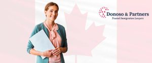 Woman holding file in front of Canadian Flag